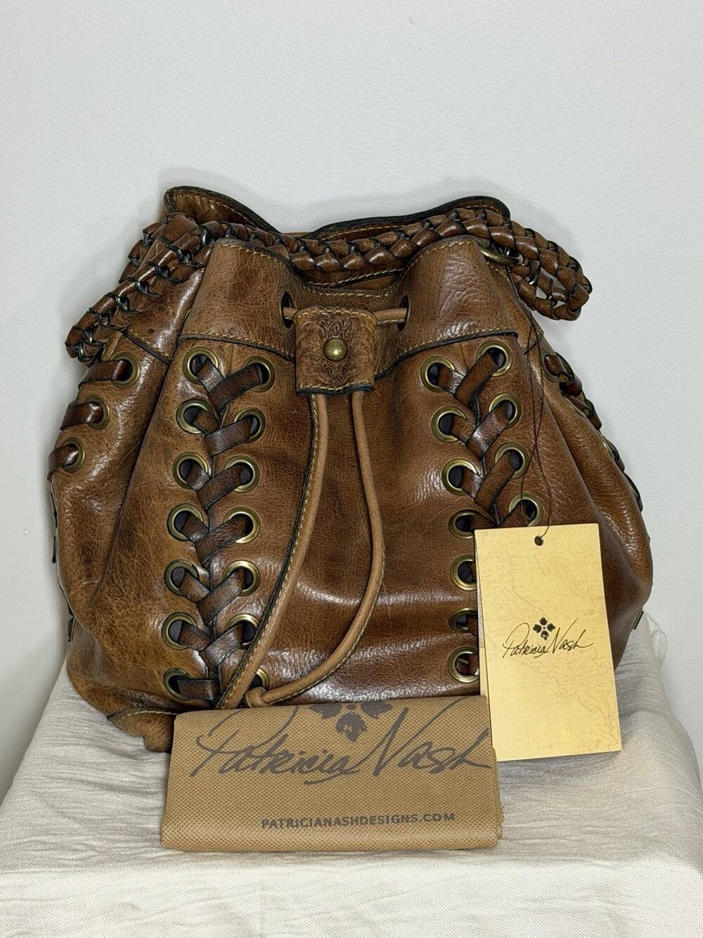 Patricia Nash Bucket Bag Woven Drawstring Brown Braided Distressed Grommet